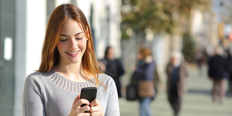 Young woman using mobile phone for contact