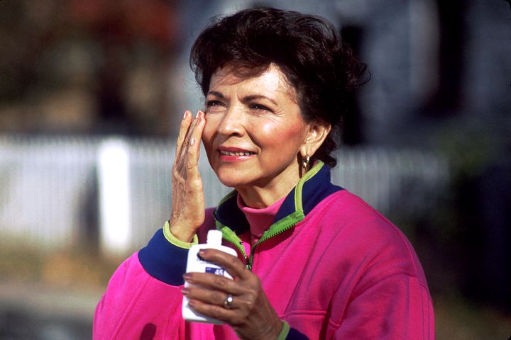 Applying sunscreen to the face