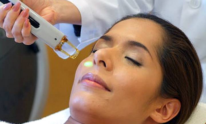 laser being used for facial treatment