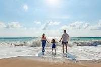 Family on sunny beach