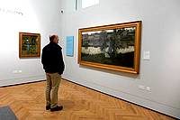 Looking at painting in gallery