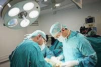 two surgeons performing a surgery